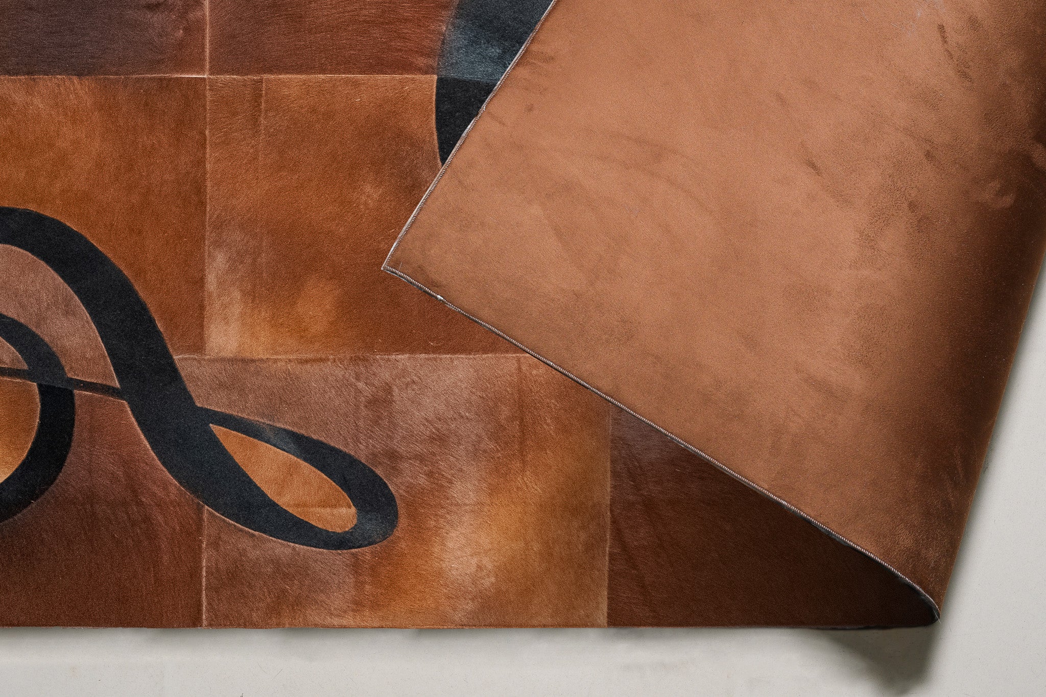 Music-Themed Patchwork Cowhide Area Rug