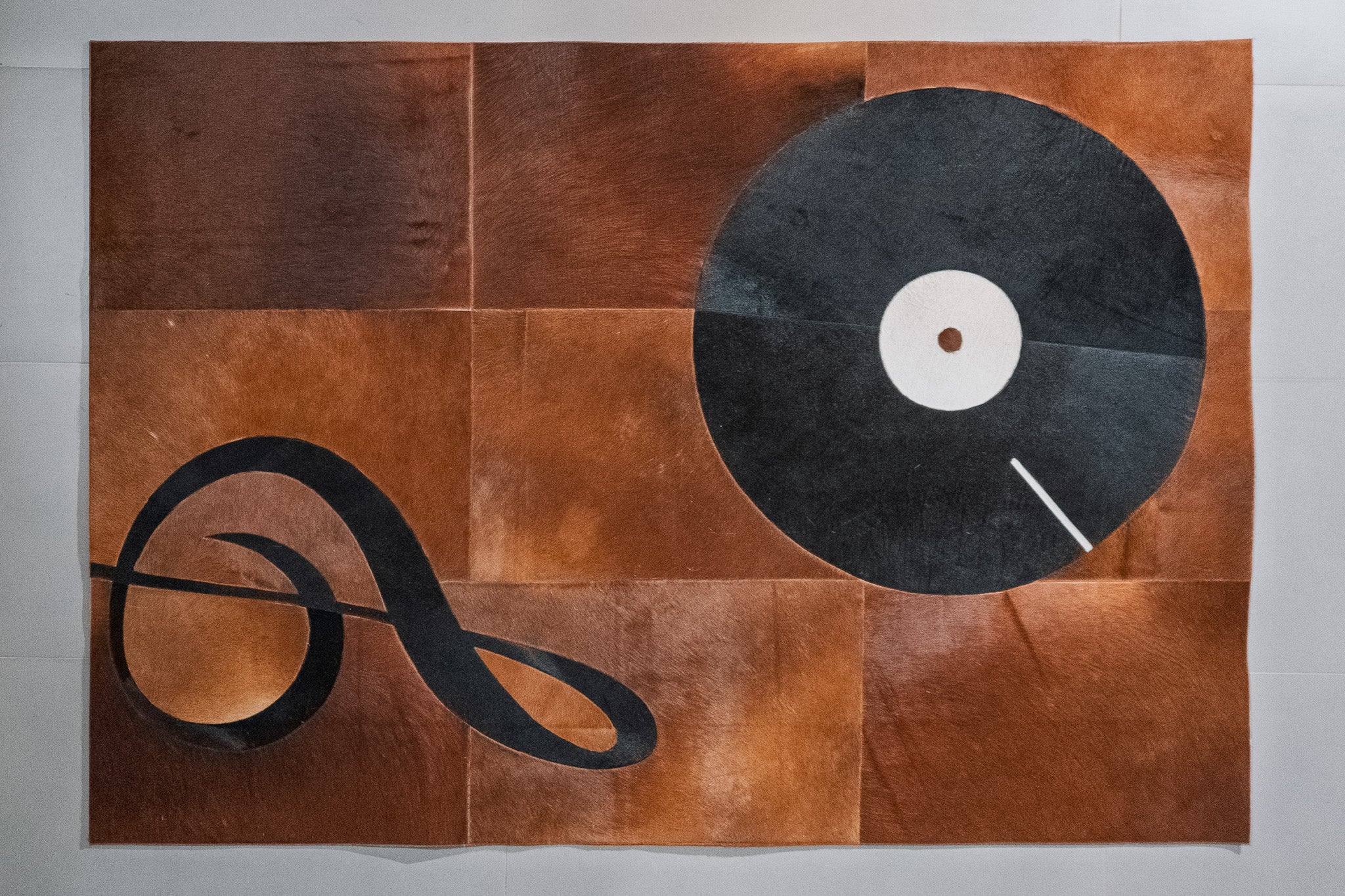 Music-Themed Patchwork Cowhide Area Rug